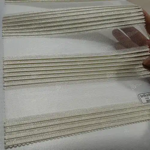 نمونه پارچه پرده زبرا پلیسه دار ریز کد T2530، رنگ طلایی با لمه براق طلایی، مناسب برای دکوراسیون مدرن