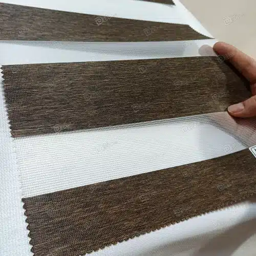 نمونه پارچه پرده زبرا طرح چوب کد T2847، ساده با بافت ظریف و رنگ قهوه‌ای تیره، مناسب برای دکوراسیون منزل و محیط کار.