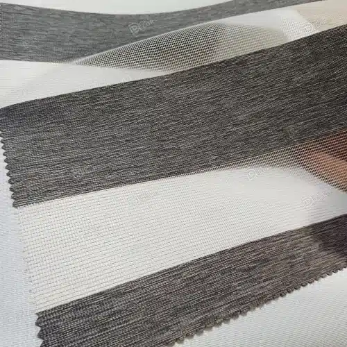 نمونه پارچه پرده زبرا طرح چوب کد T2849، ساده و بافت‌دار ظریف، به رنگ طوسی تیره، مناسب برای دکوراسیون مدرن.